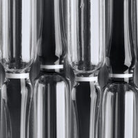Background of glass medical ampoules. Ampoules close-up.
